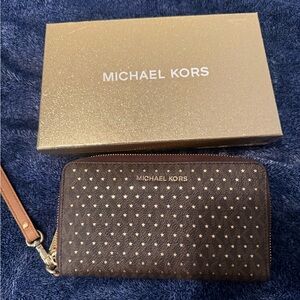 Michael Kors Brown Wristlet with Gold Star Pattern